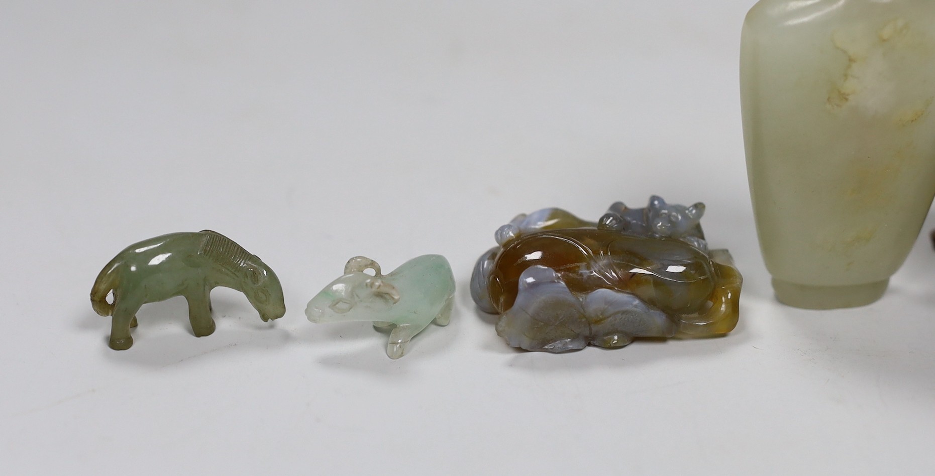 A Chinese jade snuff bottle, together with six animal hardstone figures, and a small perfume bottle